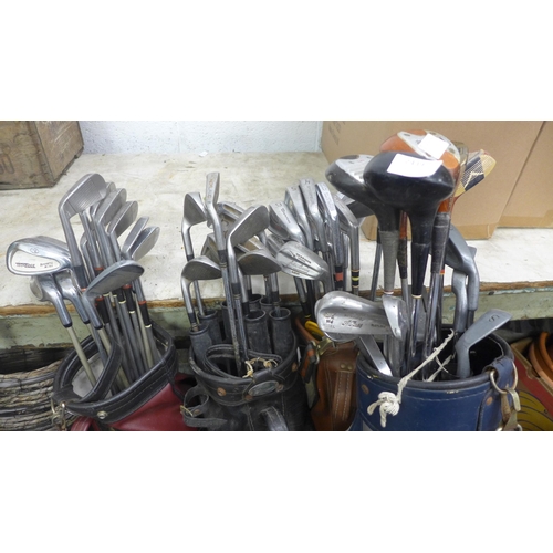 2439 - 4 Golf bags and approx. 40 golf clubs