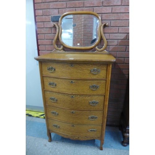 1 - An early 20th Century French oak serpentine dressing chest