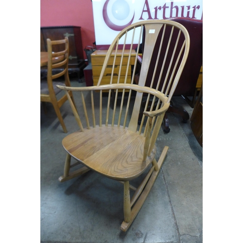 101 - An Ercol Blonde elm and beech Chairmaker's rocking chair