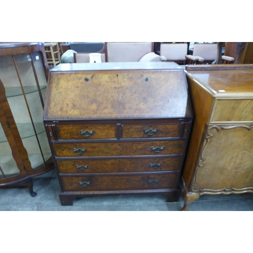 131 - A George I style burr walnut bureau