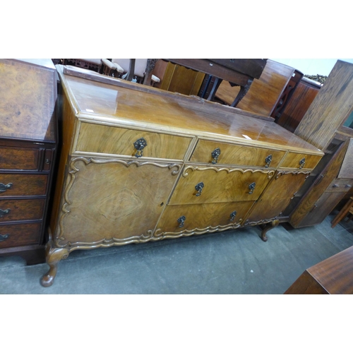 132 - A Queen Anne style walnut sideboard