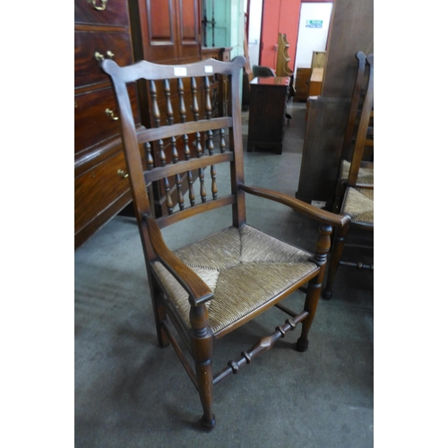 148 - A set of ten 18th Century style beech spindle back rush seated chairs