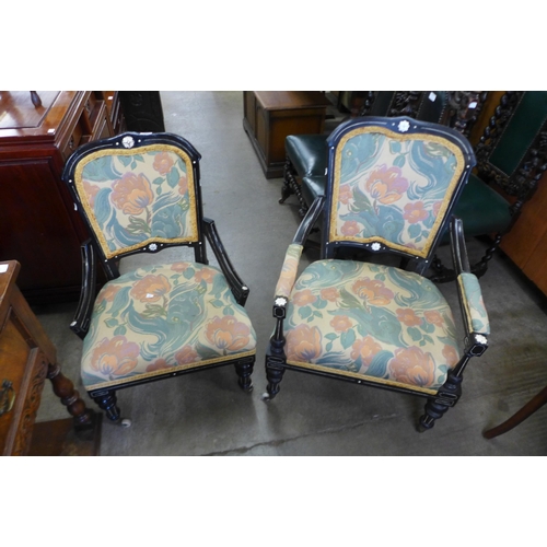 171 - A pair of Victorian Aesthetic Movement ebonised and fabric upholstered chairs