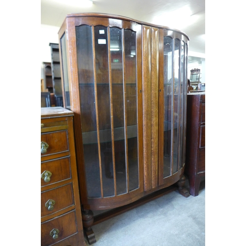 182 - An oak two door display cabinet