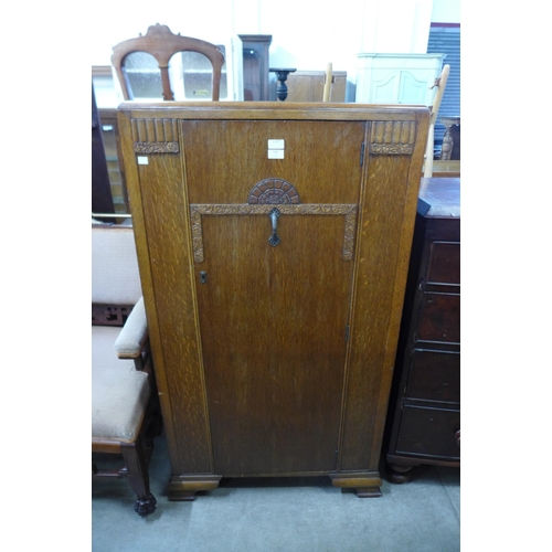 198 - An Art Deco oak tallboy