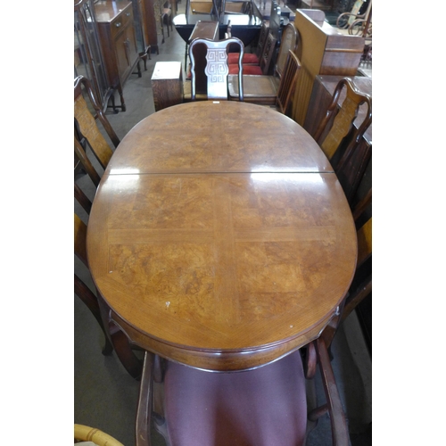 233 - A Chinese elm and hardwood extending dining table and six chairs