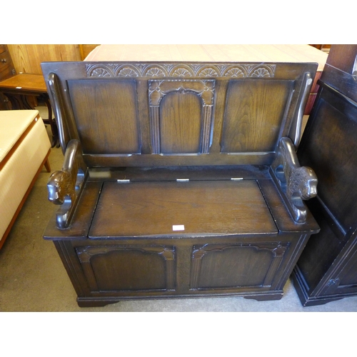 236 - A carved oak dresser and a monk's bench