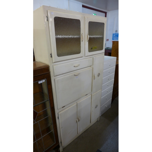 248 - A painted kitchen cabinet and a chest of drawers