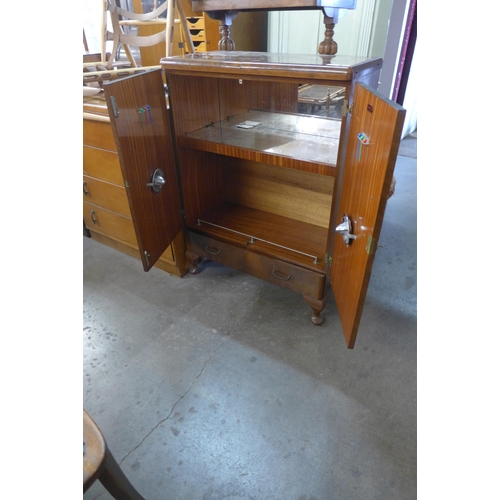 250 - A figured walnut cocktail cabinet