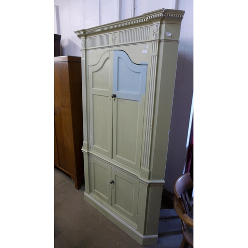 257 - A George III style painted freestanding corner cupboard