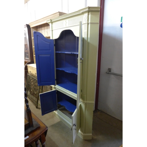 257 - A George III style painted freestanding corner cupboard