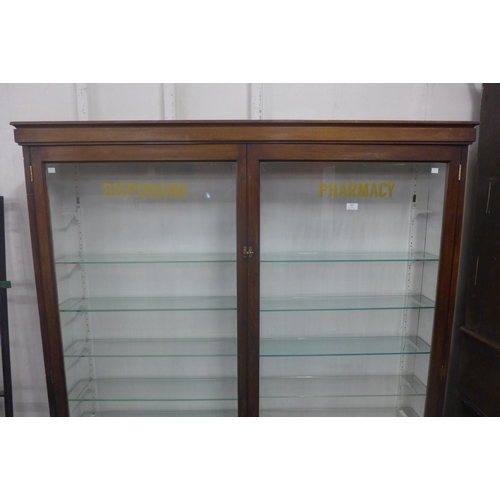 260 - A Victorian glazed mahogany pharmacist's dispensing shop cabinet