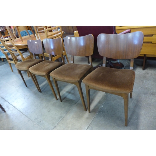 97 - A set of four teak dining chairs