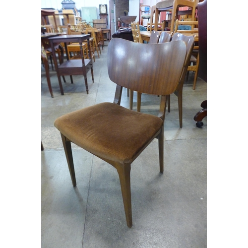 97 - A set of four teak dining chairs