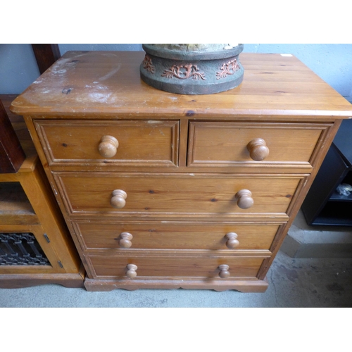 1638 - A hardwood TV unit, side table and a pine two over three chest of drawers