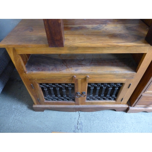 1638 - A hardwood TV unit, side table and a pine two over three chest of drawers