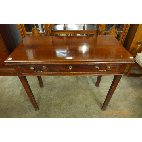 131 - A George II mahogany single drawer fold over tea table