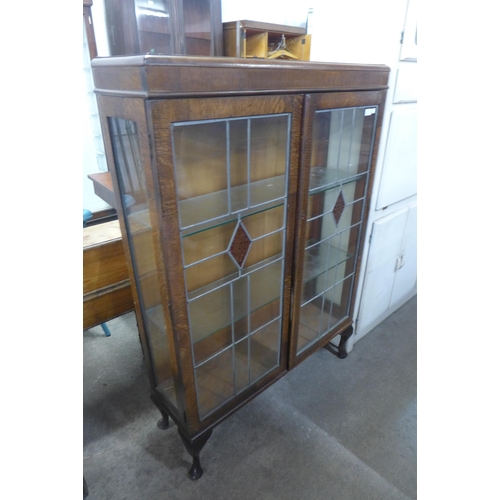 214 - An oak two door display cabinet