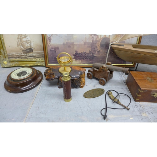 1010 - A mixed lot of nautical items, model boat, framed prints, telescope, model cannon, bosun's whistle a... 