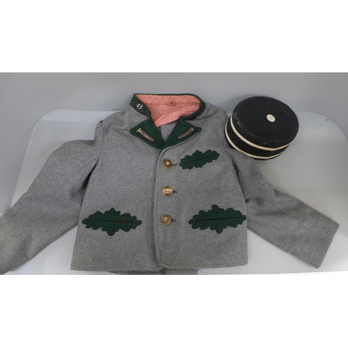 696 - A WWII German Hitler Youth jacket and cap, with added badges, (fit 4-6 yrs approximate)