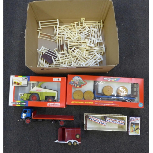 709 - Britains toys including a flat bed lorry, forage harvester, trailer, etc.