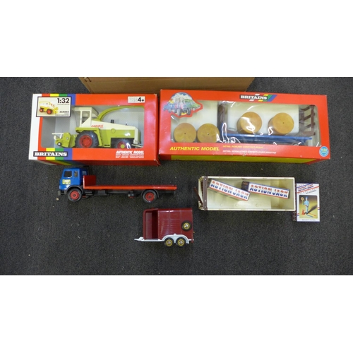 709 - Britains toys including a flat bed lorry, forage harvester, trailer, etc.