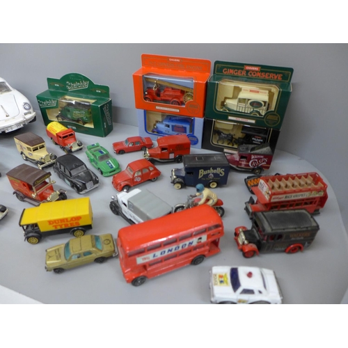 715 - A collection of die-cast model vehicles, mainly advertising vans and a Burago Porsche