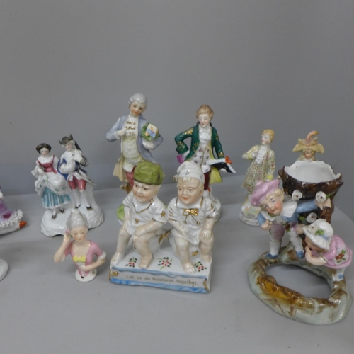 718 - Sixteen German and continental figures including spill holders and pin cushion doll, some a/f