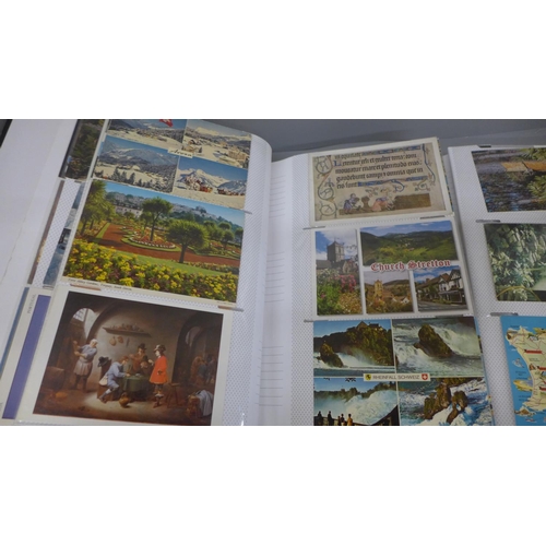 733 - Two postcard albums containing approximately 600 modern postcards