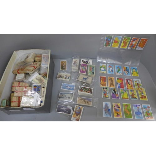 750 - A collection of cigarette cards and collector cards including John Player, Disney picture cards, etc... 