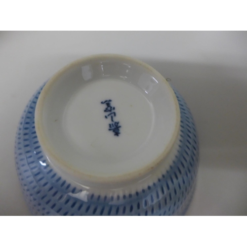 765 - A blue and white mug, a bowl and an enamelled lidded vase, a/f