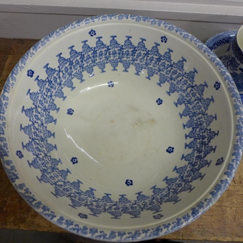 769 - A royal blue continental jardiniere with Kaufmann figures to front, blue and white large wash bowl, ... 