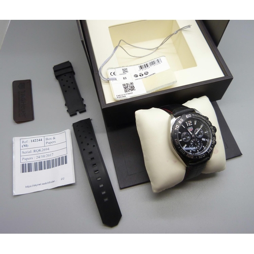 824 - A Tag Heuer Formula 1 quartz wristwatch, on an alligator strap and with spare rubber strap, as new w... 