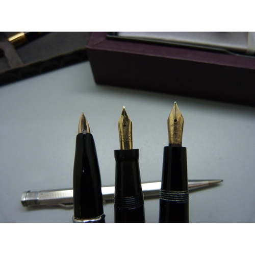 827 - A black and gold plated Waterman pen with 18ct gold nib, three pens with 14ct gold nibs, Burnham No.... 