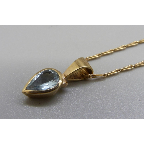 883 - A 9ct gold and topaz pendant and chain, 4.5g, chain 39cm