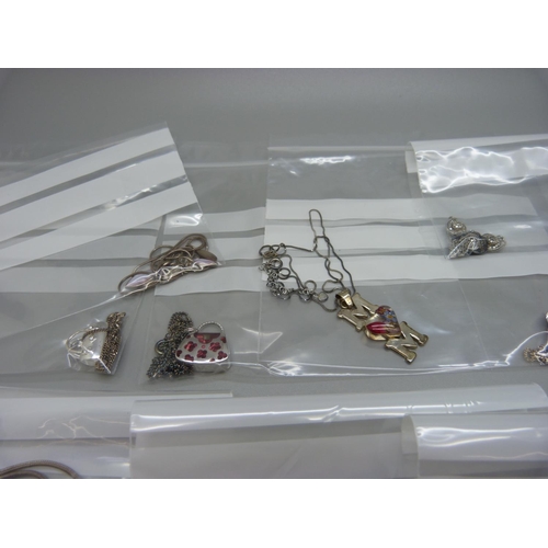 886 - Ten silver pendants and chains