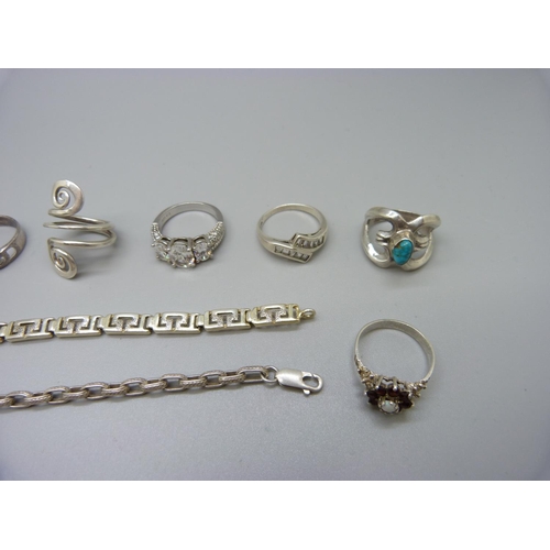 915 - Ten silver rings, three white metal rings including garnet and opal cluster and two silver bracelets