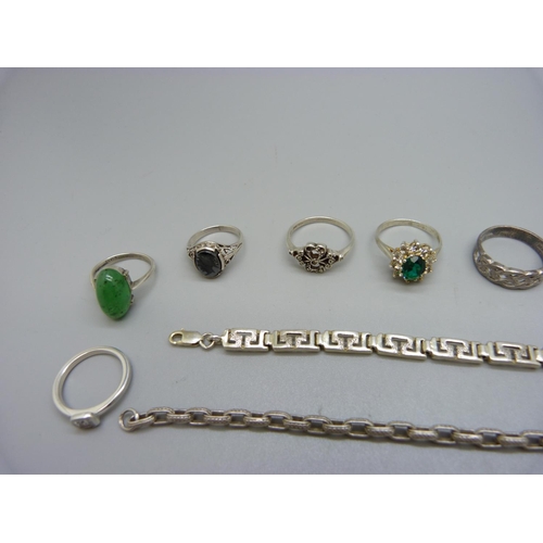 915 - Ten silver rings, three white metal rings including garnet and opal cluster and two silver bracelets