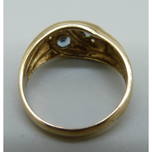 926 - A 9ct gold ring set with blue and white stones, (lacking one small white stone), 3.5g, P