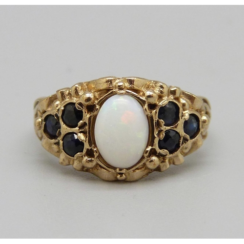 927 - A 9ct gold sapphire and opal ring, 3.6g, L