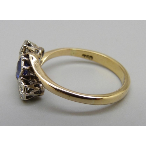 928 - A yellow metal, sapphire and diamond crossover ring, 3.4g, O