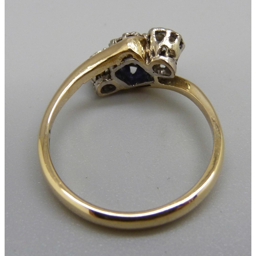 928 - A yellow metal, sapphire and diamond crossover ring, 3.4g, O