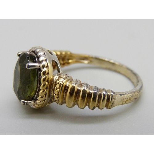 968 - A silver gilt, Modavite solitaire ring, with certificate, L