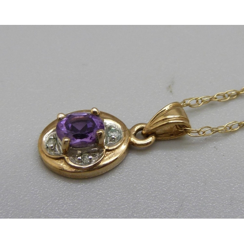 971 - A 9ct gold pendant set with diamonds and an amethyst on a fine 9ct gold chain, 1.3g