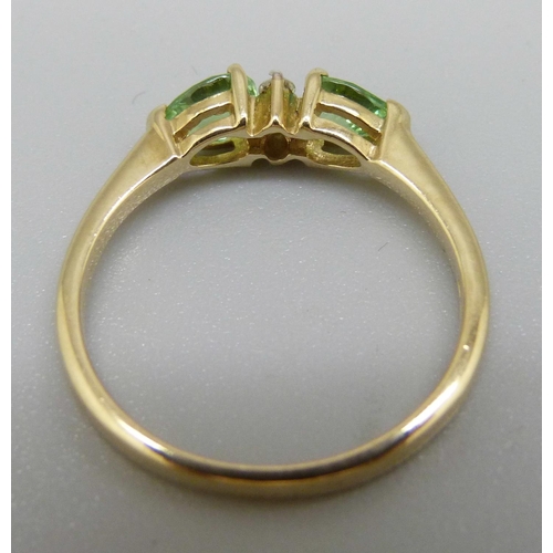 972 - A 9ct gold ring set with green and white stones, 1.8g, N