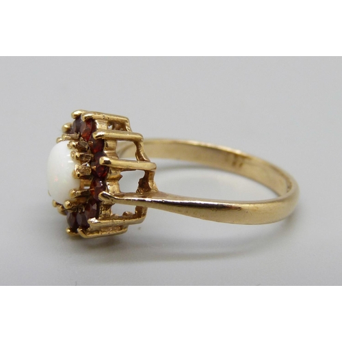 973 - A 9ct gold garnet and opal cluster ring, 2.5g, M