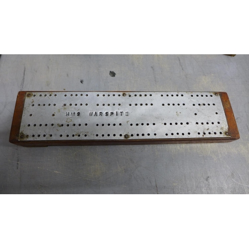 991 - Three cribbage boards, including one marked HMS Warspite, and three sets of dominoes