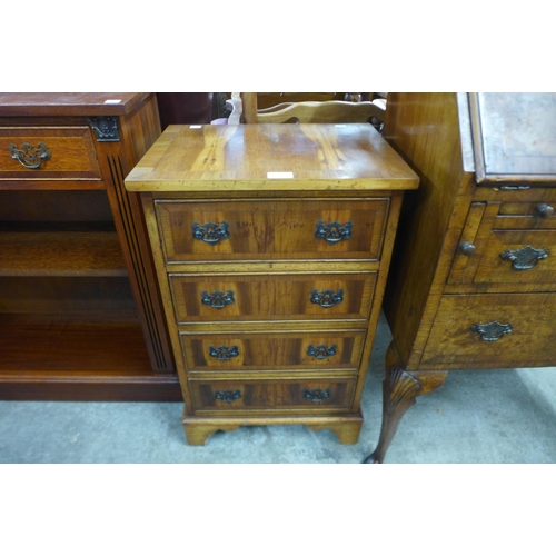 101 - A small yew wood chest of drawers