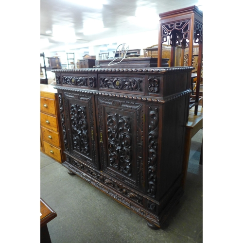 111 - A 19th Century Portuguese carved oak cupboard