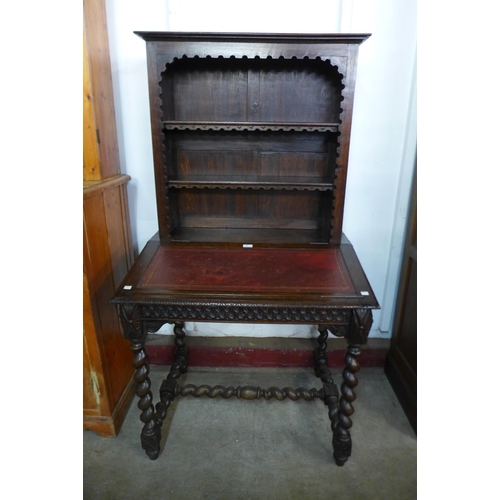 120 - A 19th Century French carved oak barleytwist writing table/bookcase